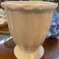 White ceramic vase with fluted design and wide rim. Available in small, medium, and large sizes.