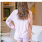 Light Pink Brushed Hacci High Low Pullover; soft fabric, high-low hem. Available in sizes XS–XXL.
