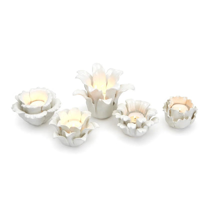 Set of five white succulent-shaped tealight candleholders with blooming flower design; sizes: small, medium, large.