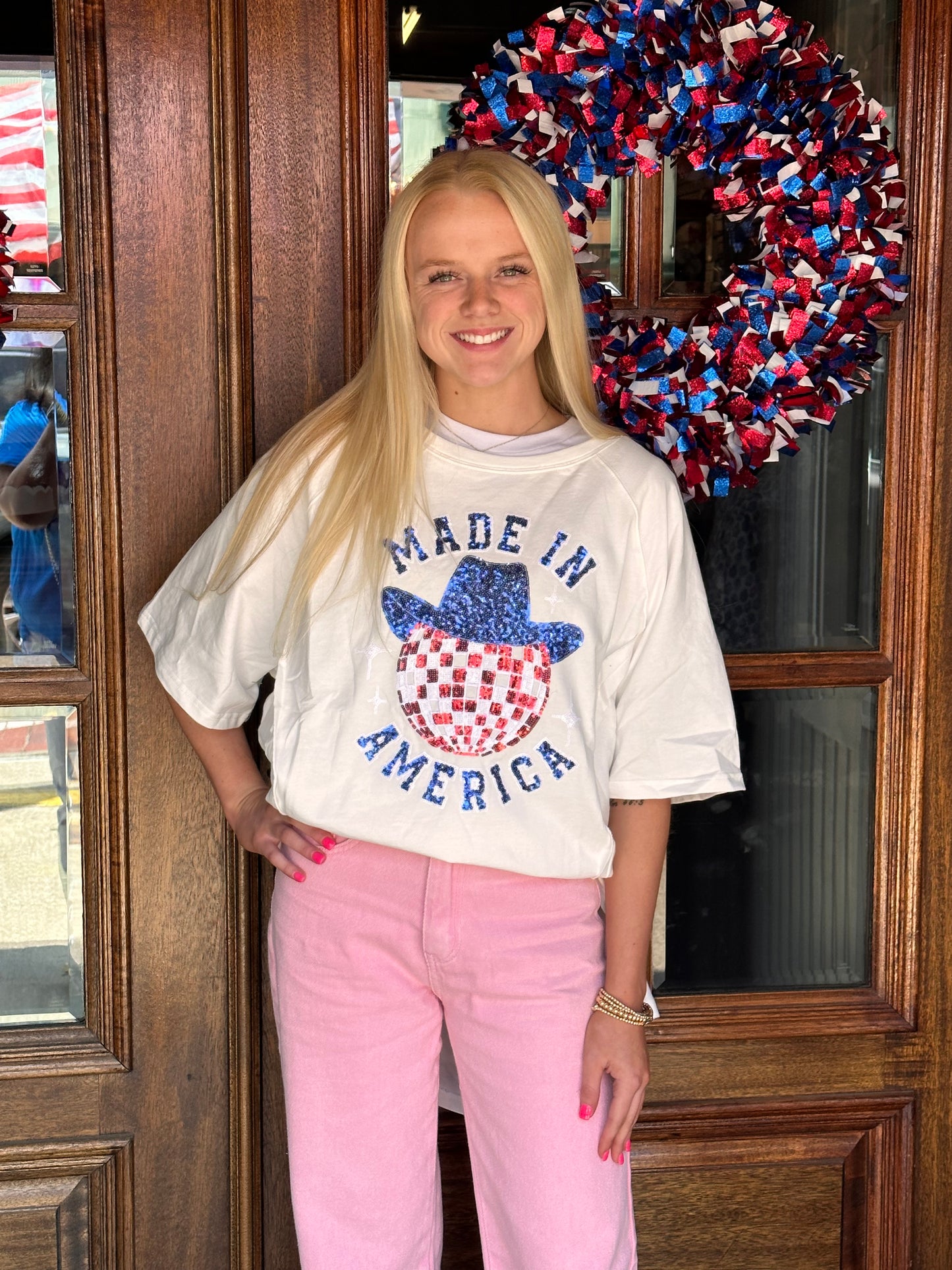 America Disco - French Terry Shirt with sequined hat graphic. Available in sizes S-XL. Pink pants not included.
