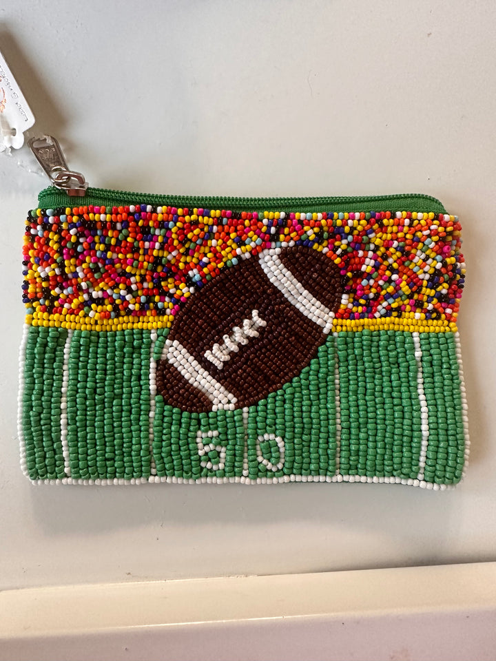 Beaded football sequin wallet with green field, white "50" yard line, green zipper. Sizes available: Small, Medium.