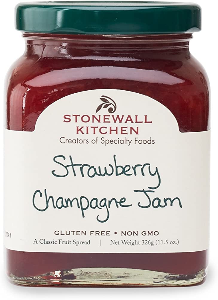 Stonewall Kitchen Strawberry Champagne Jam, 11.5 oz glass jar, white label with handwritten-style text, gluten-free, non-GMO.