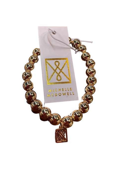 Shiny Gold Bracelet with gold beads and a square charm. Available sizes: Small, Medium, Large.
