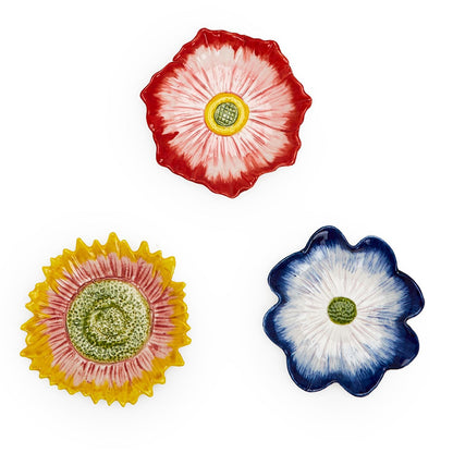 Set of three ceramic bloom-shaped trinket trays in red, yellow, and blue with painted centers. Sizes: small, medium, large.