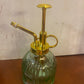 Plant Mister 3 designs 53754-20 with ribbed green glass body, gold pump; sizes available: small, medium, large.