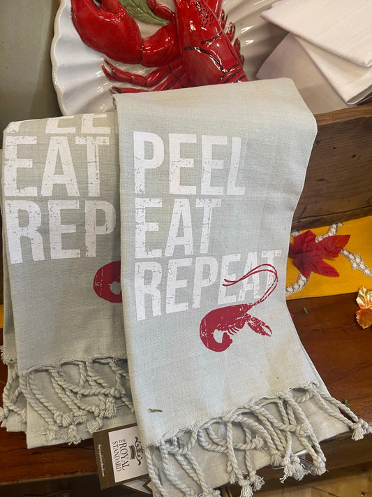 Gray 20 x 28-inch hand towel from India with white "PEEL EAT REPEAT" text and a red crawfish graphic.