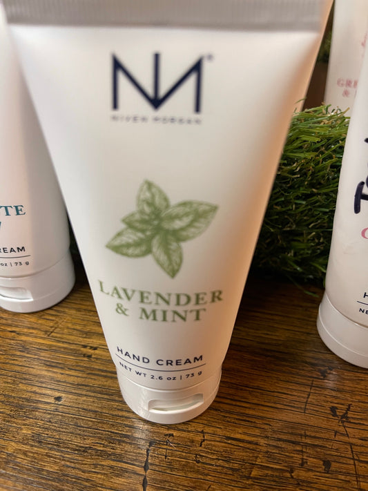 This is a 2.6 oz tube of Lavender & Mint Travel Hand Cream by nefertem. It is designed to moisturize skin and features a refreshing image of mint leaves on its packaging.