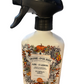 This product is a bottle of Pumpkin Spice Air Fabric Spray. The item is characterized by a decorative label, adorned with autumn-themed illustrations such as pumpkins and leaves. It comes in one standard size bottle.