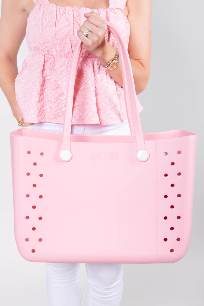 Jane Marie Multi Purpose Tote: large light pink rubber bag with round holes, white buttons. Available in small, medium, large.