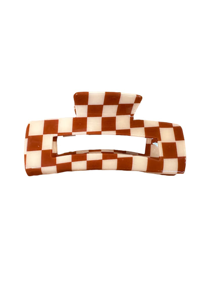 Rectangular claw clip with brown and white checkerboard pattern, wide opening, flat top handle. Sizes: small, medium, large.