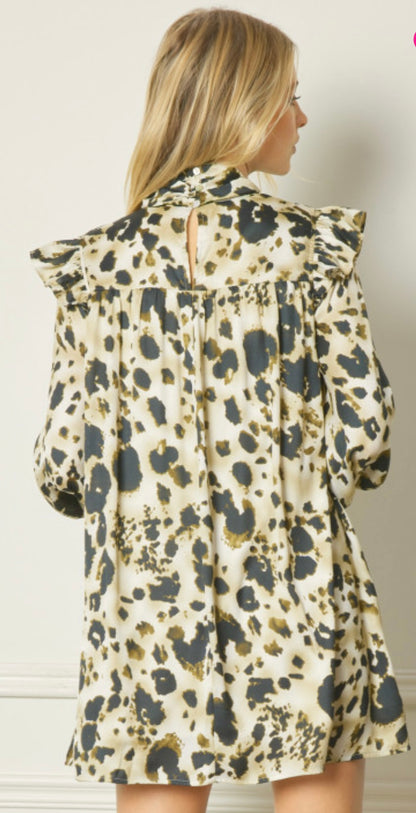 The product is a High Neck Dress in brown. It incorporates pintuck detailing and features a high collar along with an eye-catching leopard print pattern. Available sizes include Small, Medium, Large, and Extra Large.