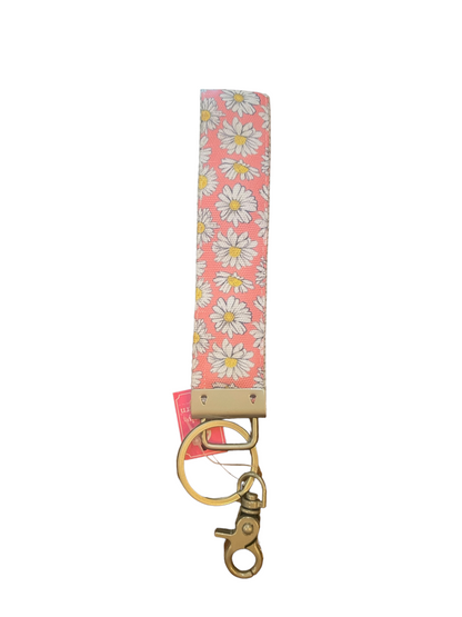 Pink fabric key fob with white and yellow daisy print, gold key ring, lobster clasp. Sizes available: one size.