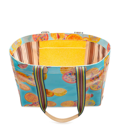 Blue tote with citrus slice print, rainbow straps, yellow striped lining, interior zipper pocket. Sizes: Small, Medium, Large.