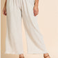 These linen pants are available in Oatmeal and Black colors. They provide a flattering fit, offering both comfort and style. The product is available in plus sizes.
