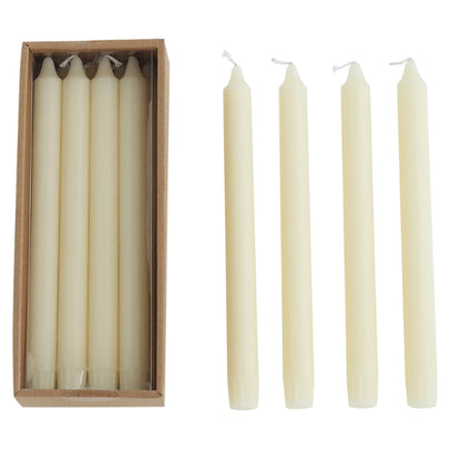 Unscented taper candles, 10”H, shown in a group of six boxed and four unboxed; available in 10-inch size.