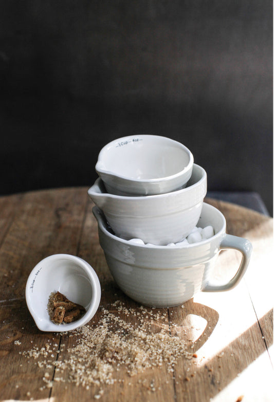 Stoneware Batter Bowls Measuring Cup Set of 4, stackable, available in ¼, ⅓, ½, and 1 cup sizes.
