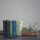 Book Storage Boxes available in multiple sizes, displayed upright and stacked on a dark wood surface.