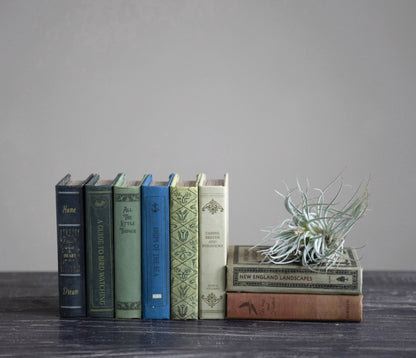 Book Storage Boxes available in multiple sizes, displayed upright and stacked on a dark wood surface.