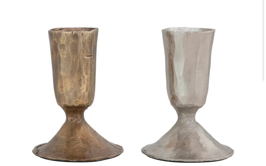Two 100% iron taper holders, hammered bronze and silver, with wide bases and flared tops. Available in multiple sizes.