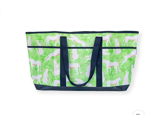 Large tote with navy handles, green base, white giraffe and plant print. Available in one large size.