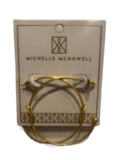 Michelle McDowell twisted gold hoop earrings; available in small, medium, and large sizes.