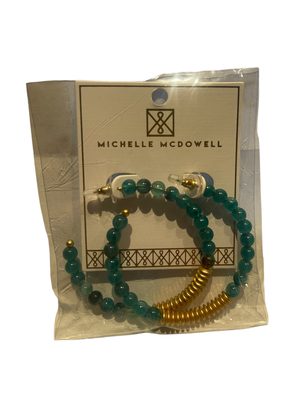 Michelle McDowell teal bead and gold accent earrings. Sizes: small, medium, large. Packaged on branded card in clear wrap.