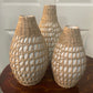 Set of 3 vases with white bases and rattan coverings; available in small, medium, and large sizes.