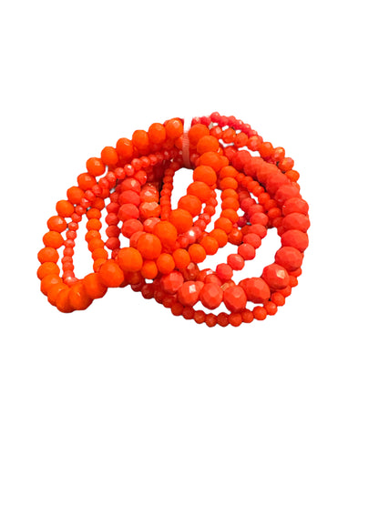 Glass Beaded Strand Bracelet with vibrant orange and red round beads in coils. Available sizes: small, medium, large.
