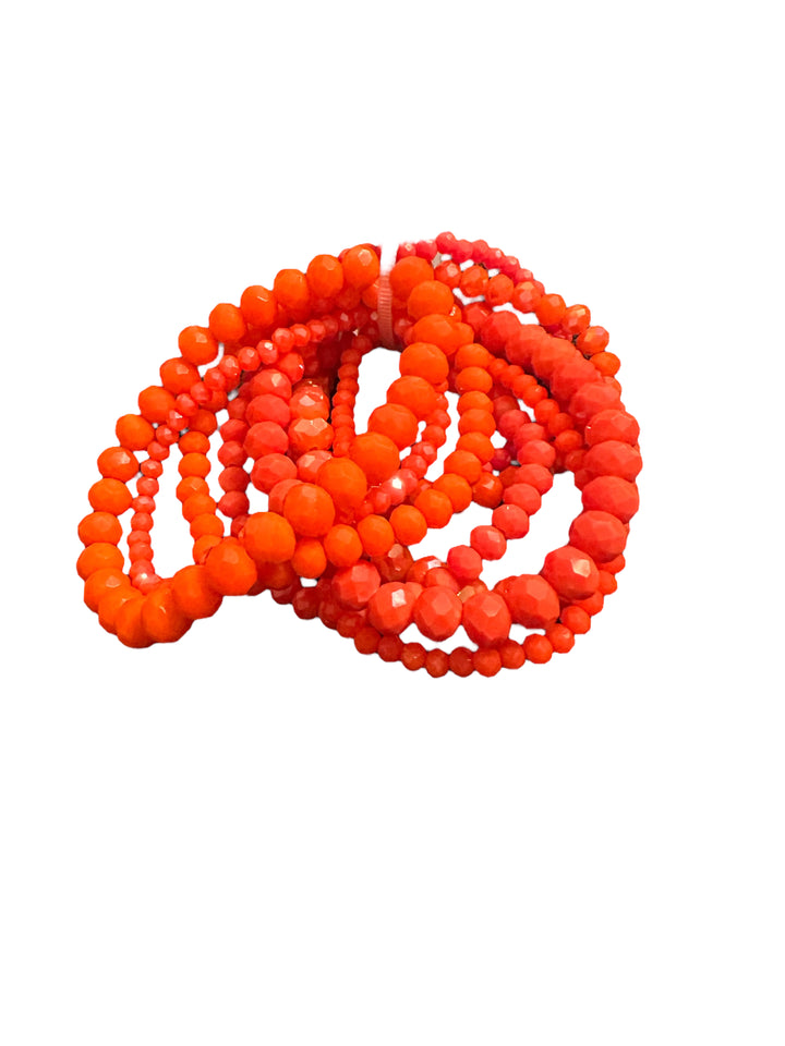 Glass Beaded Strand Bracelet with vibrant orange and red round beads in coils. Available sizes: small, medium, large.