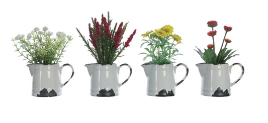 Faux flowers with white, red, yellow, and pink blooms in distressed white metal pitchers. Available in small and large sizes.