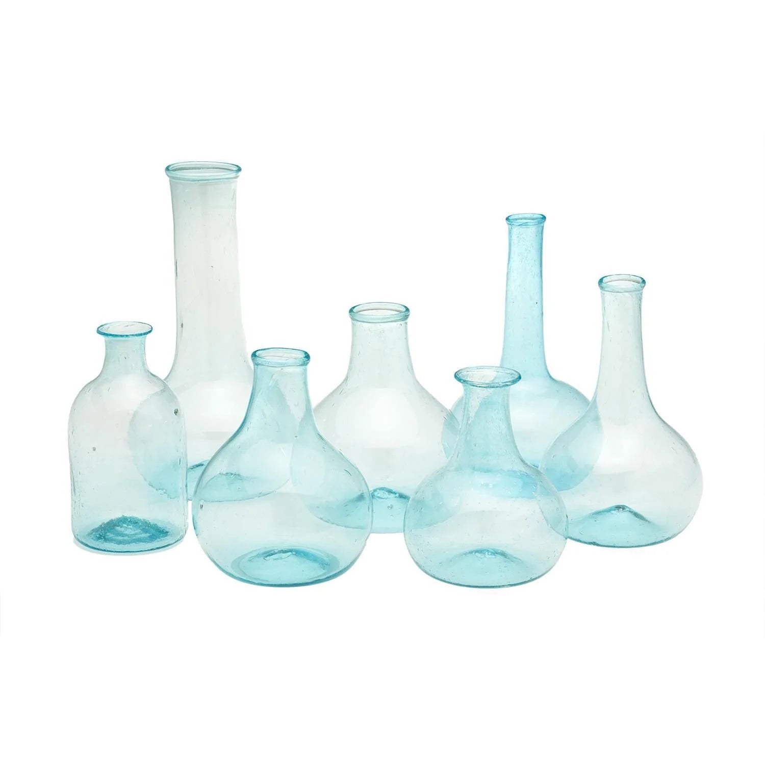 This collection consists of seven Aquamarine Bottles. Each bottle showcases a unique shape, adding diversity to the set. The bottles are crafted with a beautiful aquamarine tint, giving them a fresh, sea-glass-like appearance. Sizes of the bottles vary across the set, offering adaptability for different uses or display preferences. The product is set against and sold on a white background.