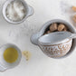 Set of 4 measuring cups with Was Relief Pattern; available in varying standard sizes.