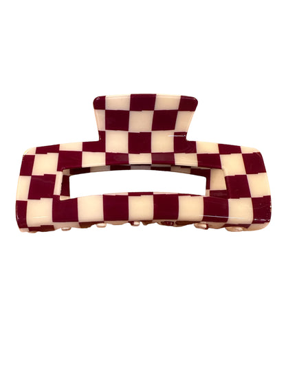 Rectangular maroon and cream checkerboard hair claw with wide grip, central cut-out. Available in standard size.