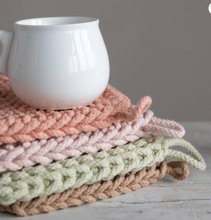 Cotton crocheted potholders in pastel peach, pink, light green, and beige. Sizes: small, medium, large.
