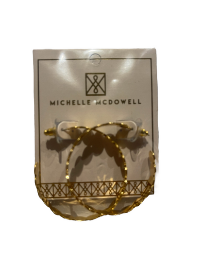 Gold textured hoop earrings by Michelle McDowell; available in small, medium, and large sizes.