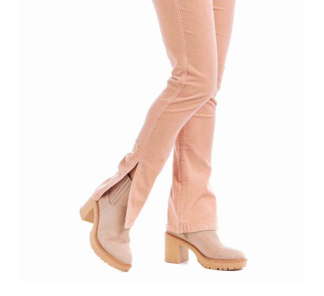 Light pink Felix Corduroy Jeans with front hem slits. Available in sizes 24–32.