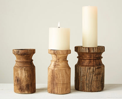 Set of three reclaimed wood candle holders, carved and weathered. Available in small, medium, and large sizes.