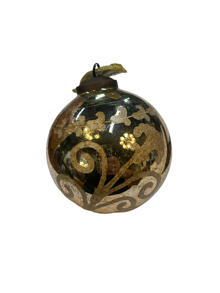 Reflective glass ornament ball with metallic floral patterns and gold ribbon hanger.