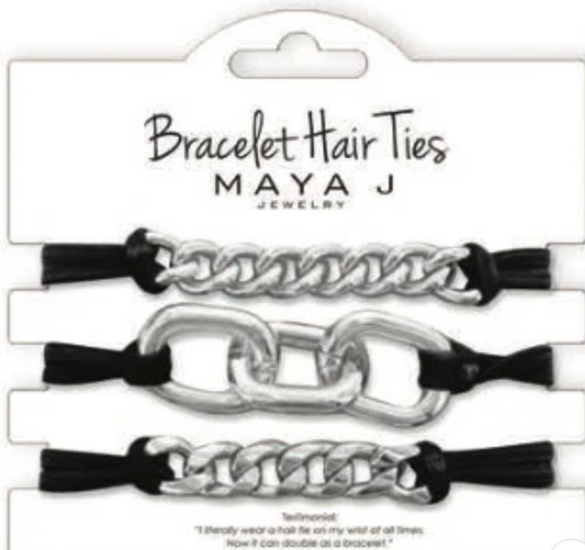 Set of three black hair ties with chunky silver chain accents. Available in one size. Can be worn as bracelets or hair ties.