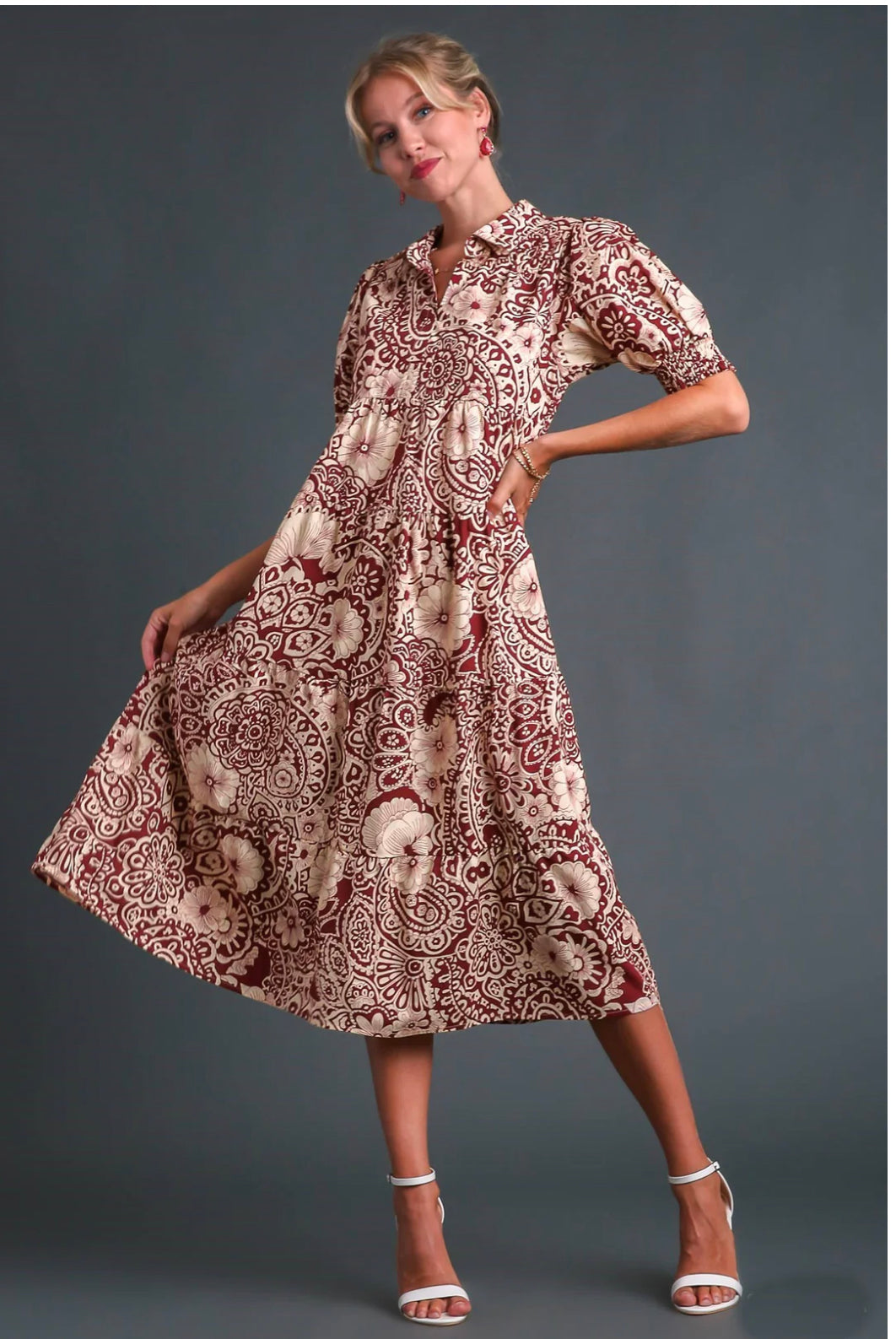 The Sangria Strolling Dress is a vibrant, swirling piece. It comes in various sizes.