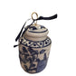 Small blue and white porcelain ginger jar ornament with lid, gold loop, dark ribbon. Available in one small size.