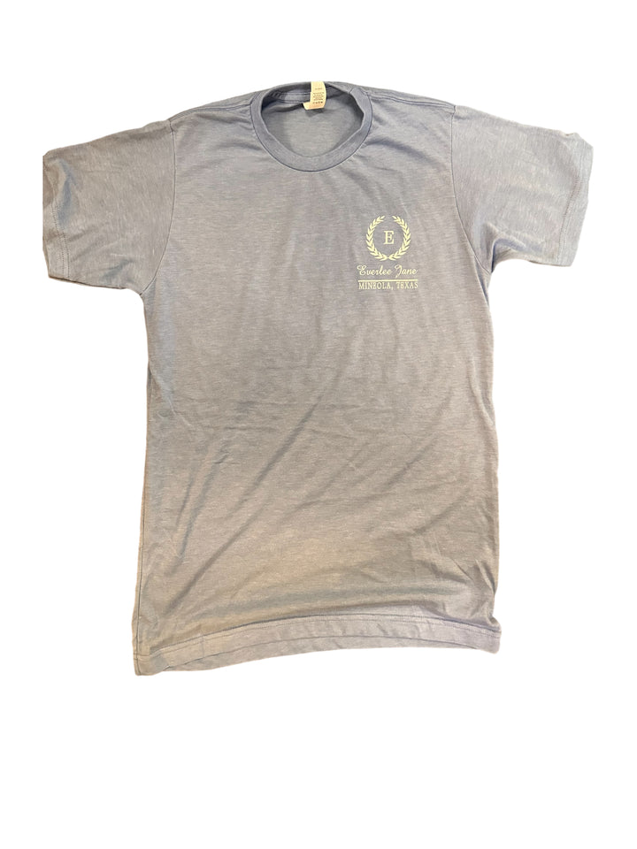 Everlee Jane unisex fit t-shirt with a small circular logo on the left chest area featuring text and graphic elements, displayed on a plain white background.