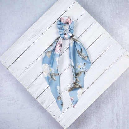 Striped Hair Scrunchie Scarf in pink, navy, light blue, and black with long draping ends; available in one size.