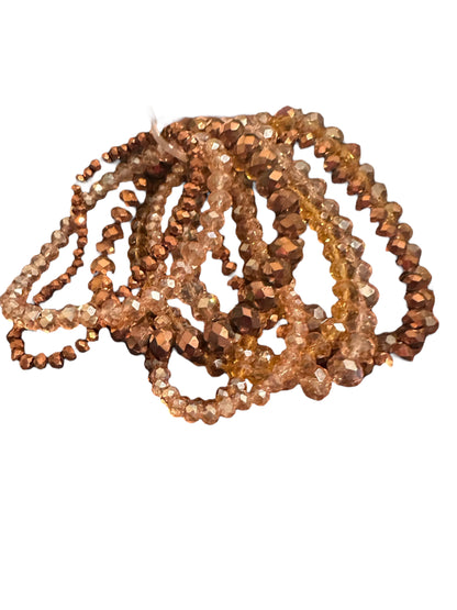 Glass Beaded Strand Bracelet with sparkly faceted brown, gold, and amber beads; available in S/M, M/L sizes.