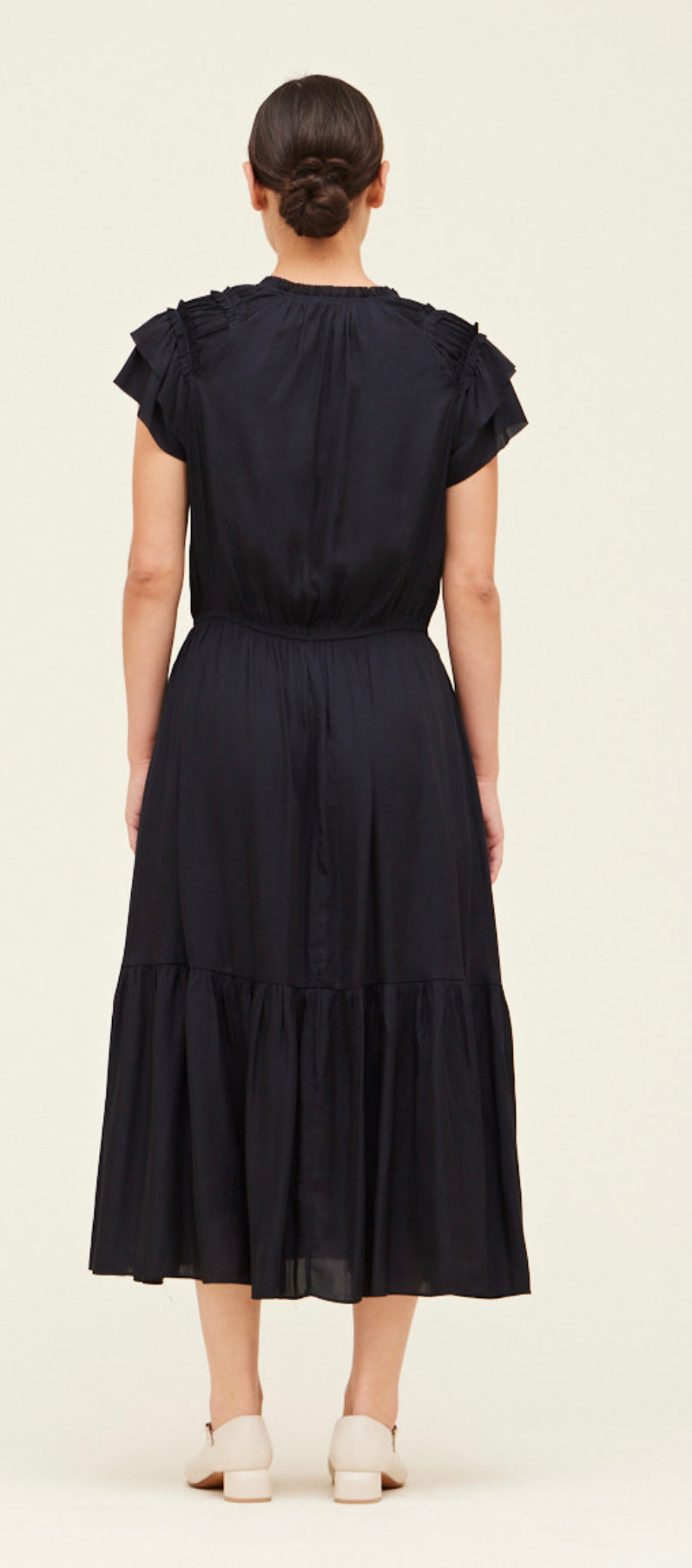 The Eclipse Navy Dress is available in sizes small, medium, and large.