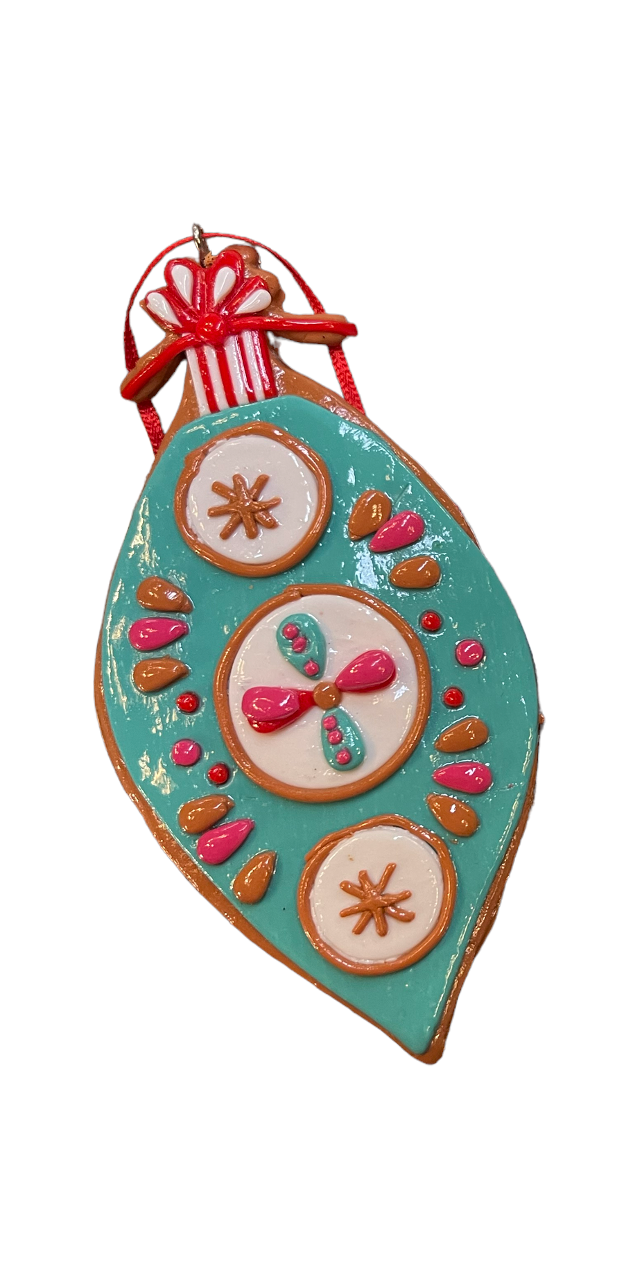 Teardrop-shaped clay dough ornament in teal, white, pink, and orange with a red ribbon.