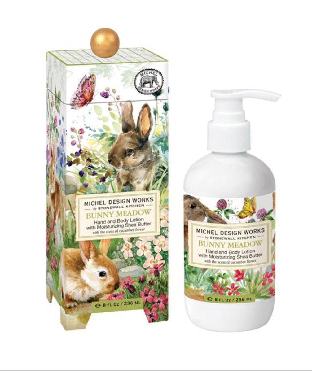 a hydrating skincare product, deeply moisturizing with Shea butter. It comes in a pump bottle, making it easy to dispense the perfect amount. The bottle is packaged in a decorative box adorned with floral and bunny illustrations. This Bunny Meadow Lotion is available in one size - 250 ml.