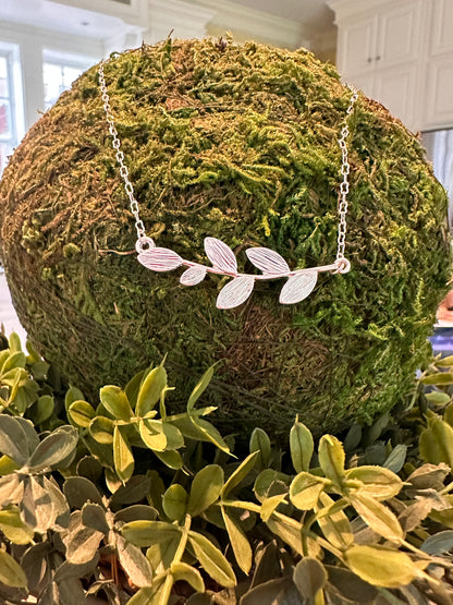 The Brady Necklace features a silver leaf design; available in multiple sizes.