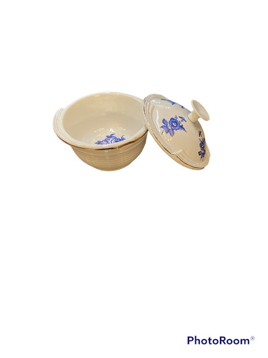 Round cream ceramic serving dish with blue floral lid. Available sizes: 1qt, 2qt, 3qt.
