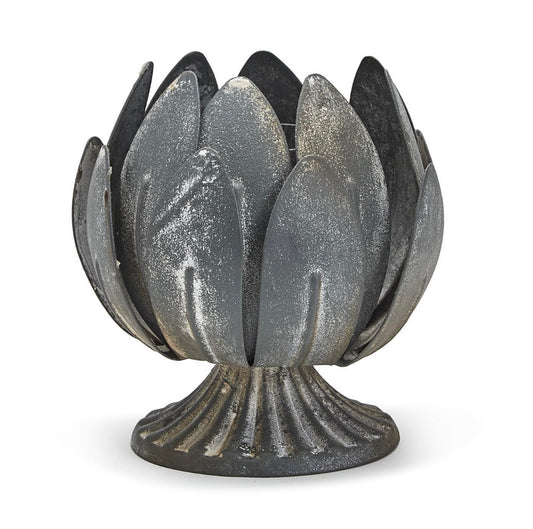 The Laurel Leaf Decorative Cachepot with weathered zinc, petal-like metal pieces on a fluted base. Available in two sizes.